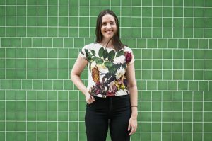 Kuwaii top on green wall