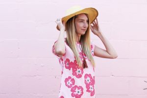 Lady wearing pink floral print Nya dress